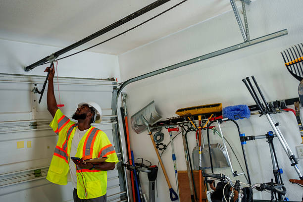Professional Garage Door Spring Repair technician working in East Brewton, AL